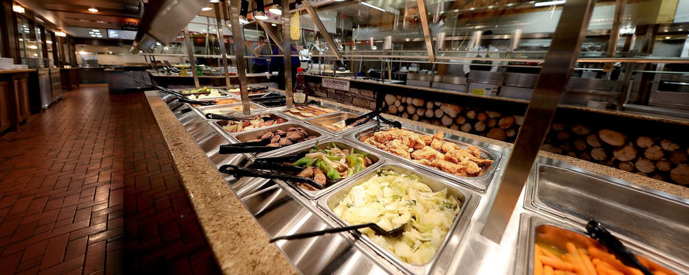 Golden Corral buffet line with trays of food