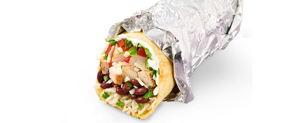 A foil-wrapped burrito with rice, beans, vegetables and chicken visible at its open end
