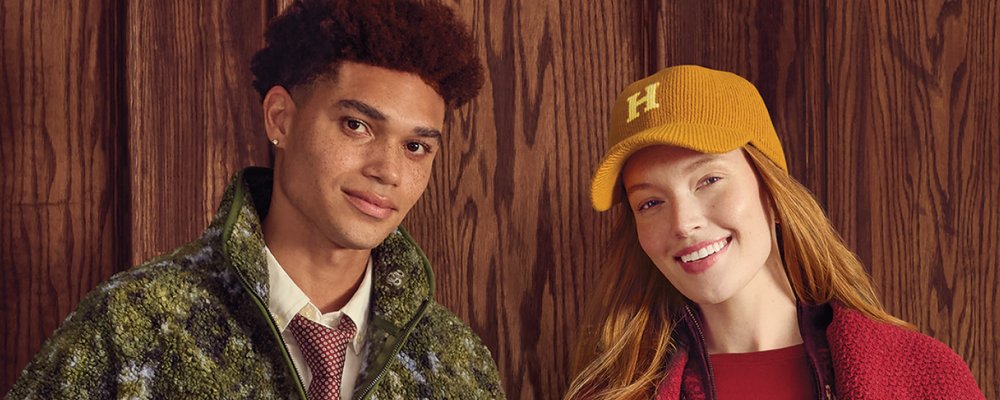 Two models wearing pieces from the Harry Potter x Target collection, including an H cap