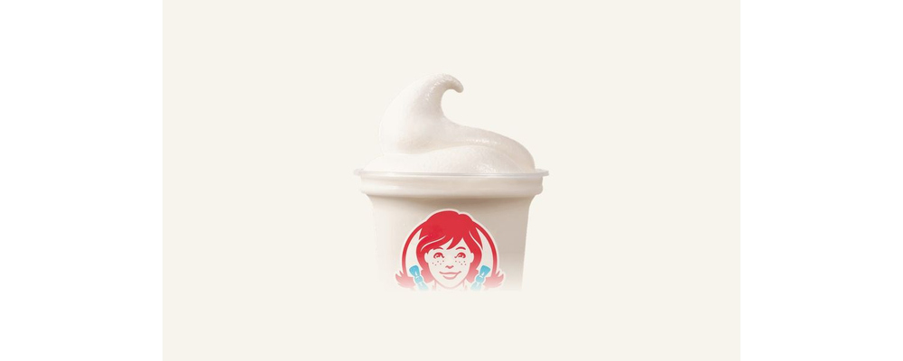 A small Wendy's cup filled with vanilla Frosty